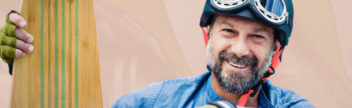 Retired male holding a skateboard