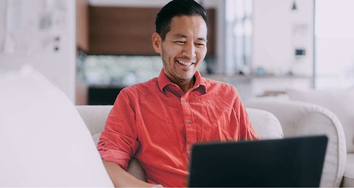 Man smiling looking at computer