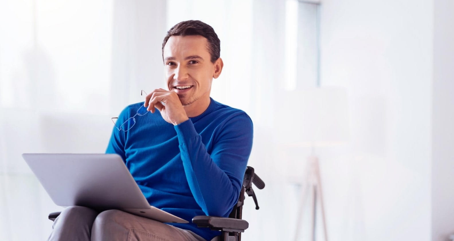 Man in wheelchair on laptop