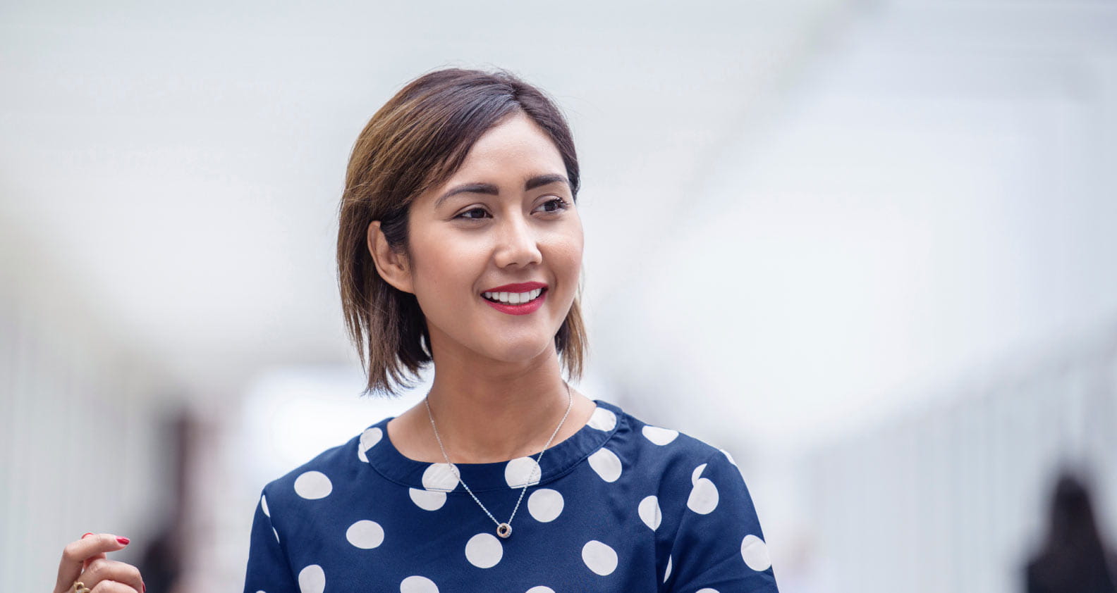 Young female smiling with blue shirt