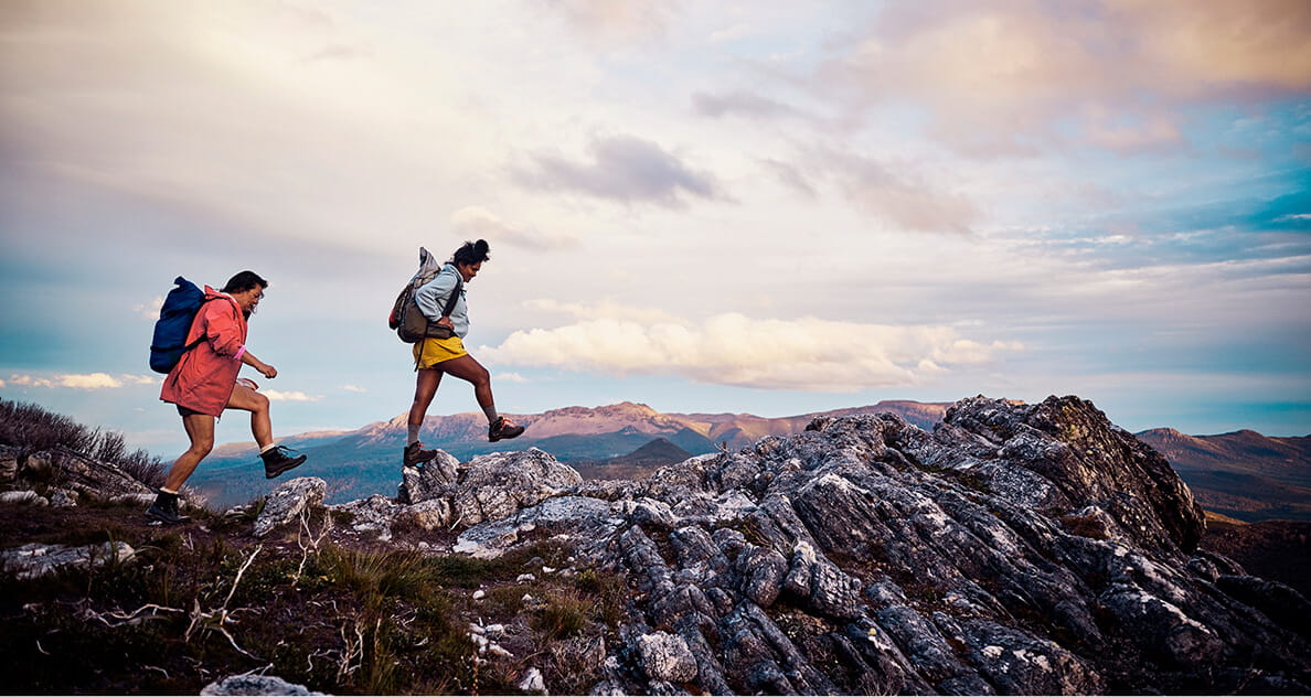 Two people hiking on a mountain