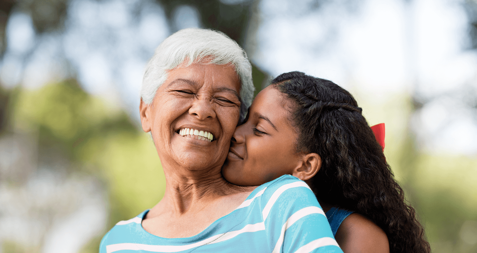 Granddaughter hugging grandma