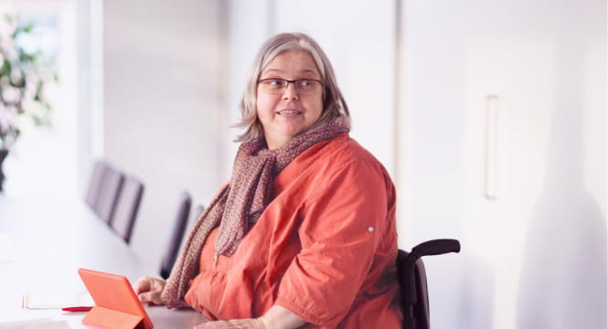 female in a wheelchair in a room