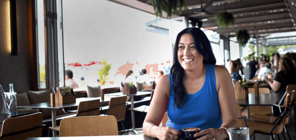 Woman in cafe smiling