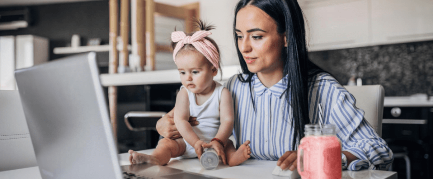 Man with baby looking at laptop