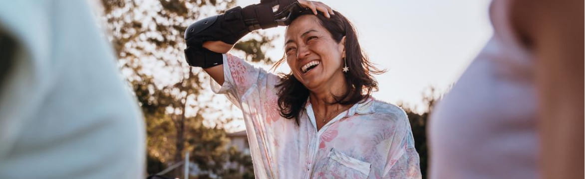 Woman in a white shirt smiling after exercise