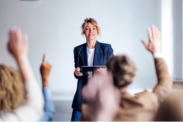 Woman asking questions in a boardroom